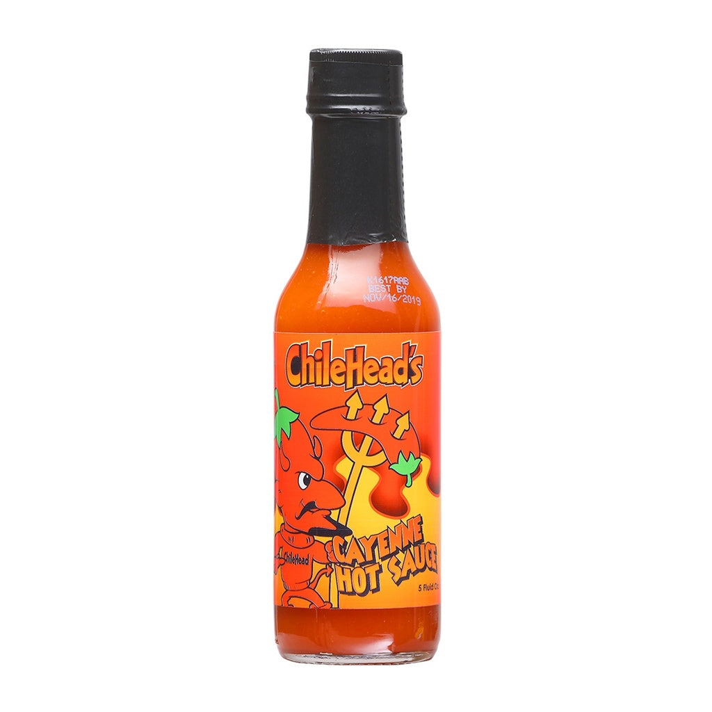 A glass bottle of Chilehead’s Cayenne Hot Sauce with a bright orange label featuring a cartoon devil holding a pitchfork, labeled “Cayenne Hot Sauce,” net weight 5 oz (150 g). UPC 609456312585.