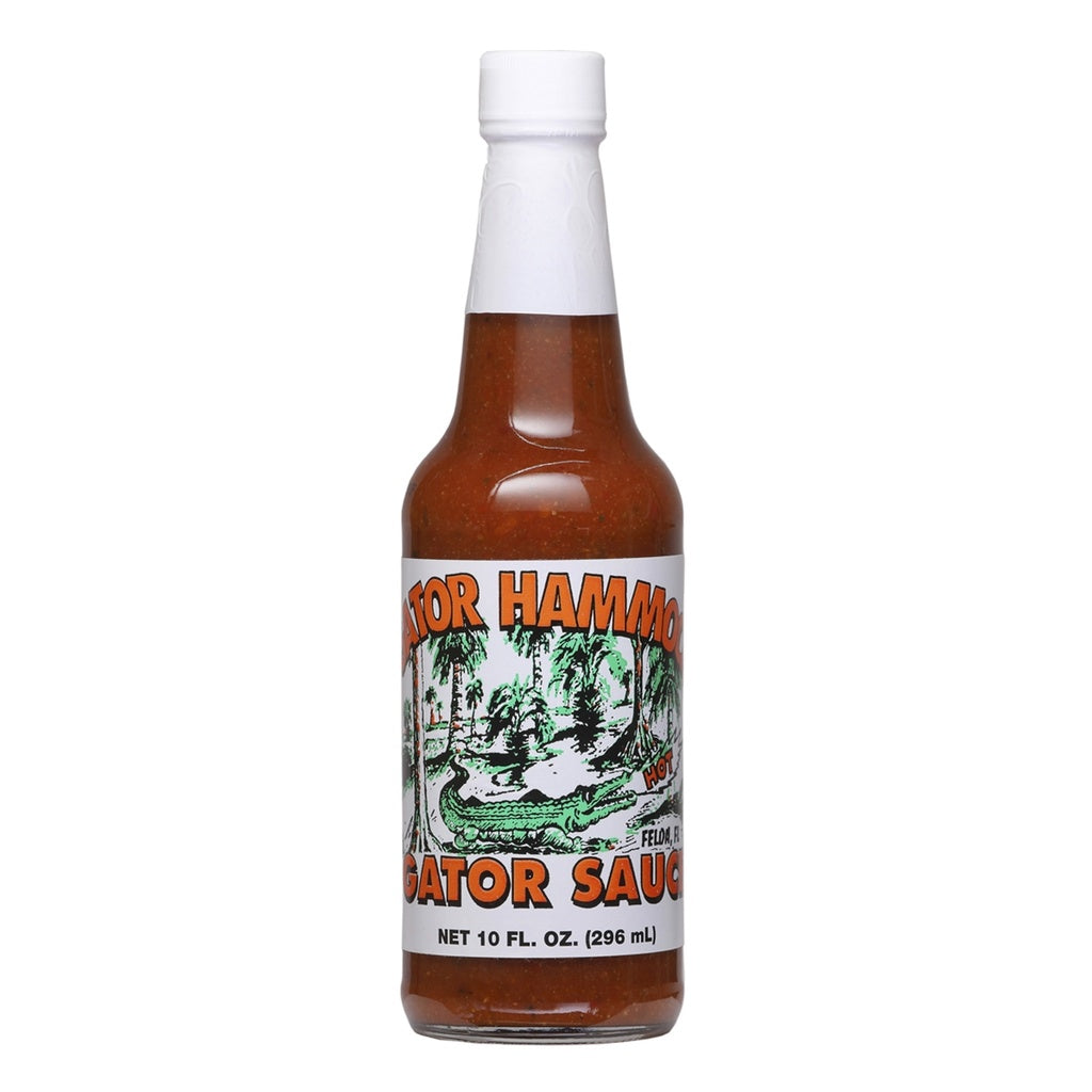 A glass bottle of Gator Hammock Gator Sauce with a white cap and illustrated alligator label, marked “Net 10 fl oz (296 mL).” UPC 748309000047.