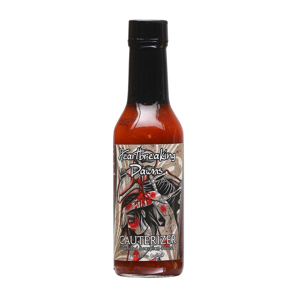 Heartbreaking Dawn’s Cauterizer Trinidad Scorpion Hot Sauce bottle featuring dark artwork and red pepper sauce in a 5 fl oz glass bottle