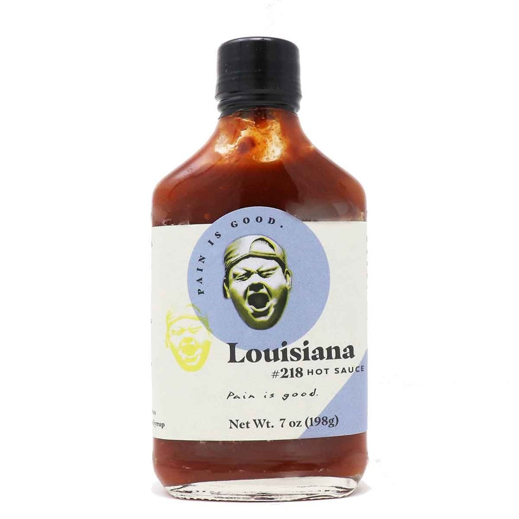 Glass bottle of Pain is Good Batch #218 Louisiana Style Hot Sauce with blue and white label and black cap showing Net Wt. 7 oz (198 g), UPC F02020070