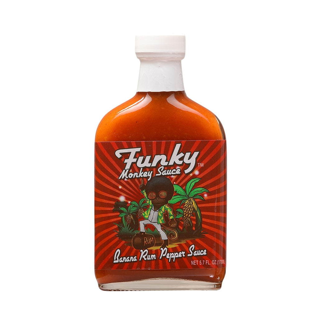 Glass bottle of Funky Monkey Banana Rum Pepper Sauce with colorful jungle-themed label, white cap, and orange-brown sauce inside; labeled 5.7 fl oz.