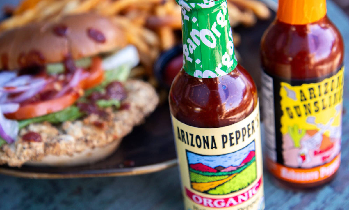Arizona Gunslinger Smokin' Hot Red Jalapeño Pepper Sauce 5 fl oz, featuring Jalapeño, shown in a manufacturer lifestyle setting