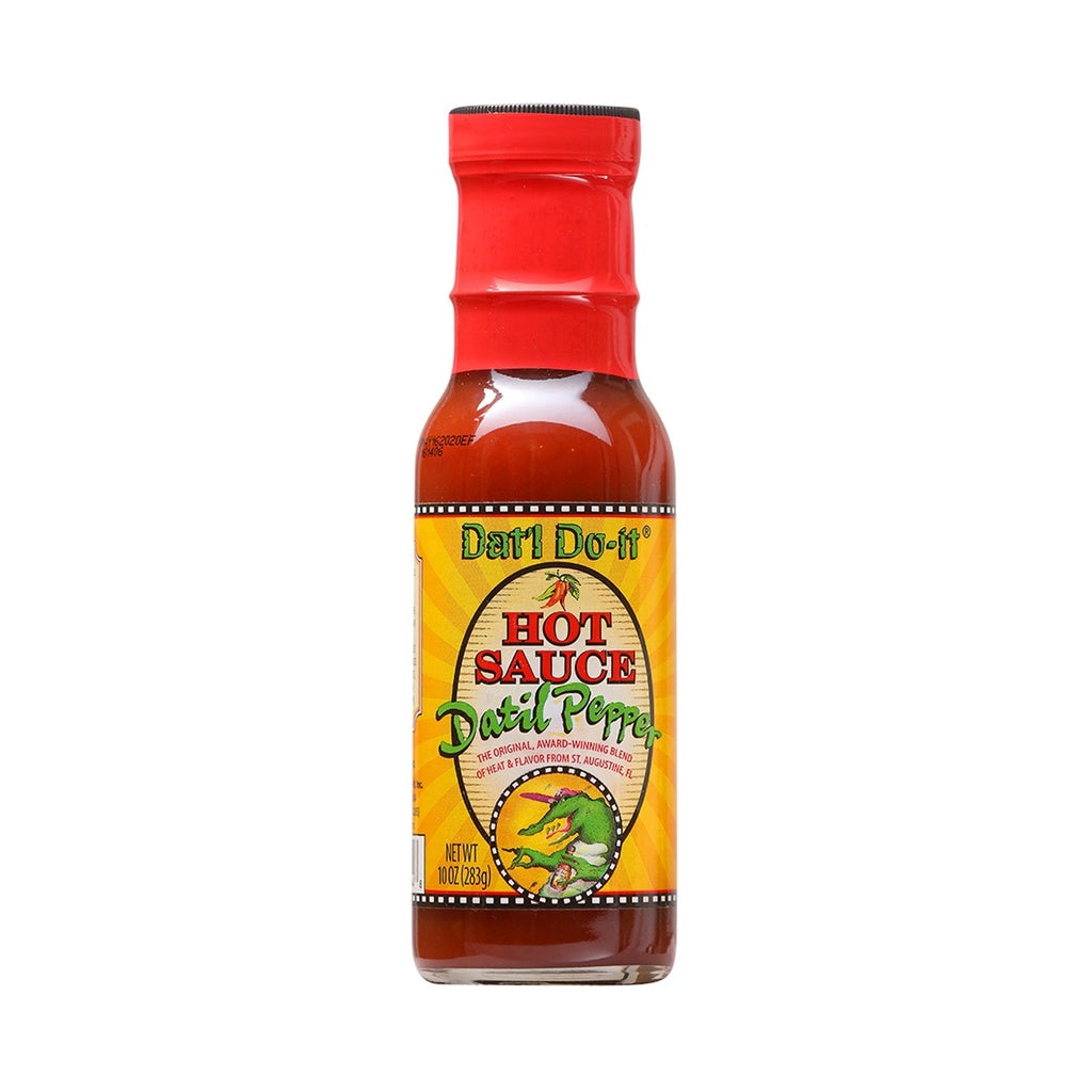 A bottle of Dat’l Do-It Datil Pepper Hot Sauce with a red cap and bright yellow label. The label reads “Hot Sauce Datil Pepper” and features a cartoon green alligator breathing fire. The bottle contains 10 ounces.