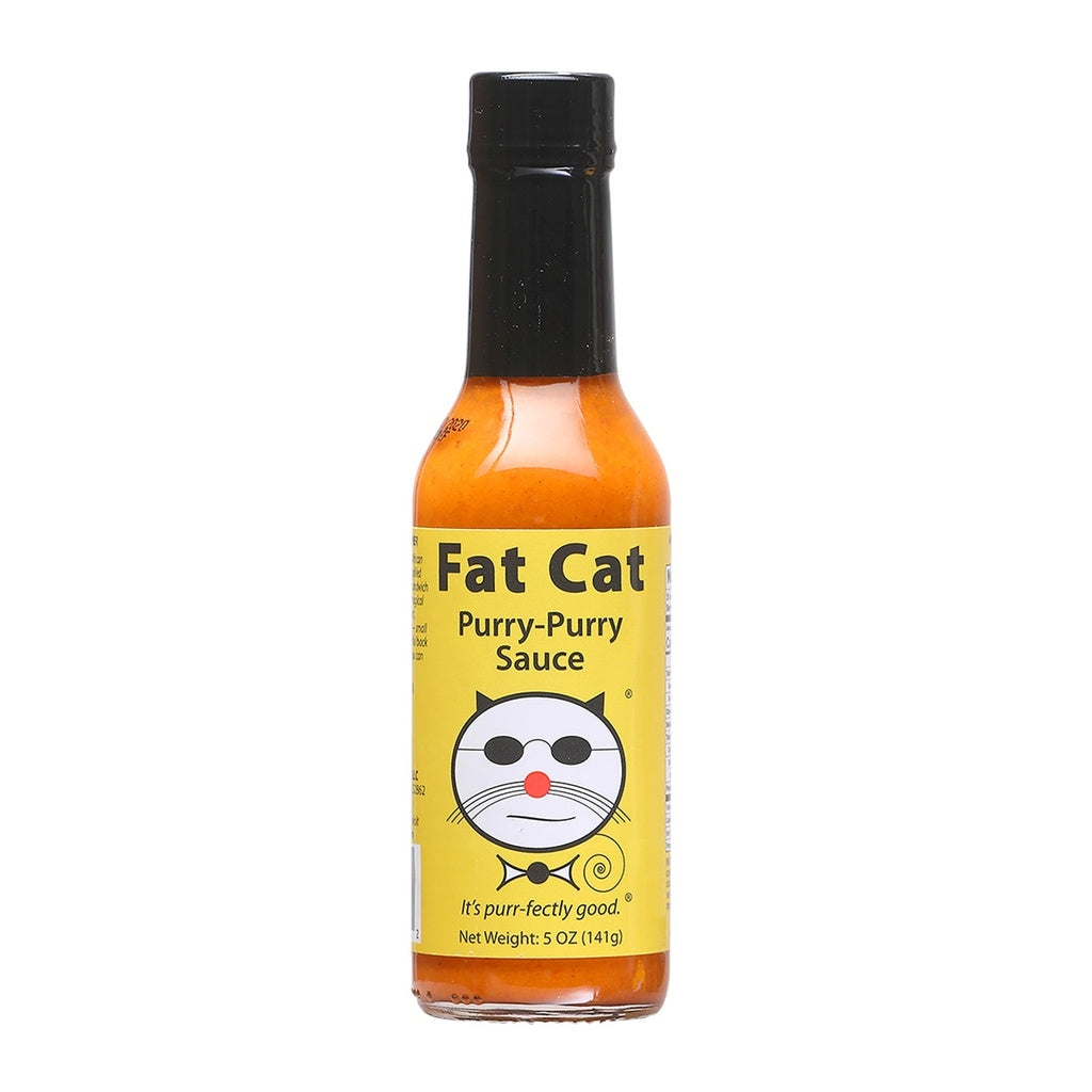 A bottle of Fat Cat Purry-Purry Hot Sauce with Peri-Peri peppers and yellow label 