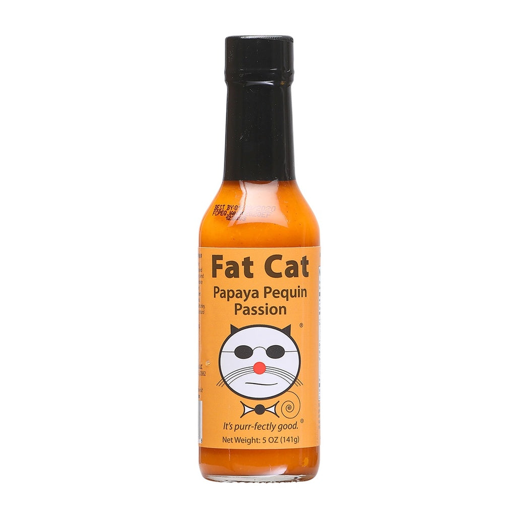A bottle of Fat Cat Papaya Pequin Passion Hot Sauce with orange label