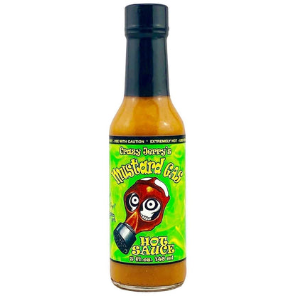 A 5-ounce bottle of Crazy Jerry’s Mustard Gas Hot Sauce with a bright neon green label featuring a cartoon gas mask with wide, crazy eyes. The sauce inside is mustard-yellow, and the label displays bold lettering that reads “Mustard Gas Hot Sauce.”