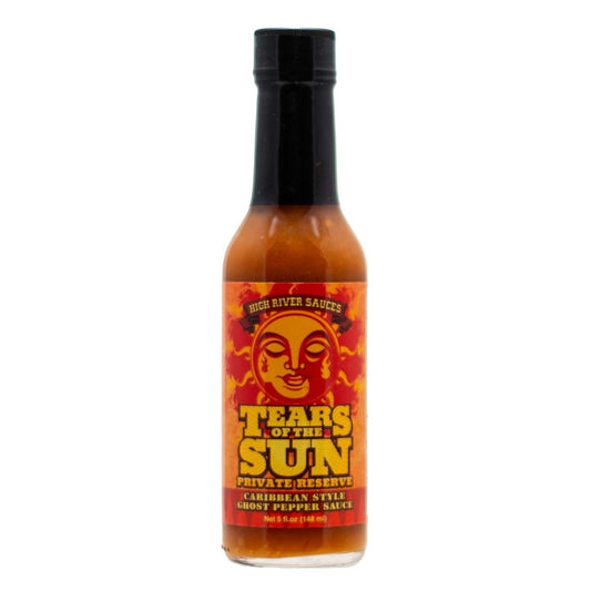 A bottle of High River Sauces Tears of the Sun Private Reserve hot sauce containing an orange Caribbean-style ghost pepper sauce. The bottle has a black cap and a fiery label featuring a stylized sun face with teardrops. Bold yellow and red text reads “Tears of the Sun – Private Reserve” with “Caribbean Style Ghost Pepper Sauce” below. The bottle size is indicated as 5 fl. oz. (148 mL).