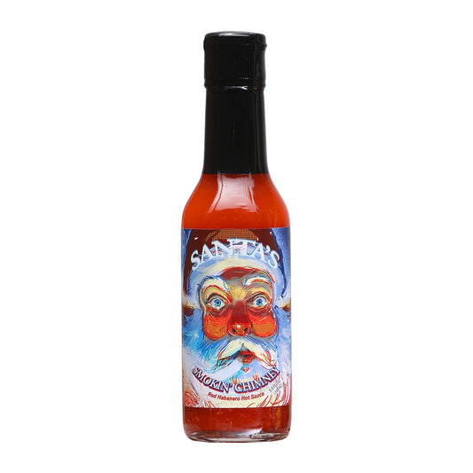 A bottle of Santa’s Smokin’ Chimney Red Habanero Hot Sauce filled with bright red sauce and topped with a black cap. The label shows a wide-eyed, flushed Santa Claus with rosy cheeks and a frosty blue beard against a wintery background. The text reads “Santa’s Smokin’ Chimney” and “Red Habanero Hot Sauce,” with the size listed as 5 fl. oz. (148 mL).