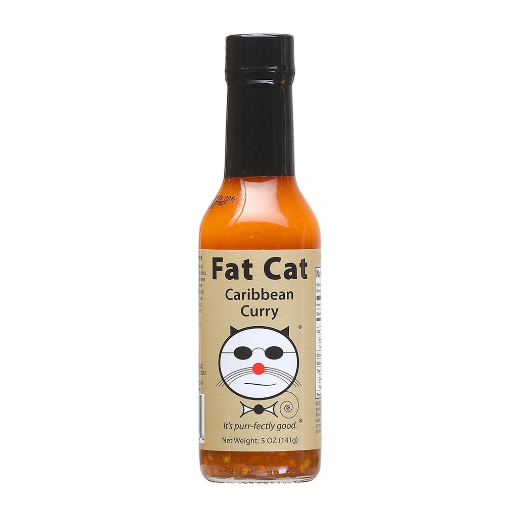 A bottle of Fat Cat Caribbean Curry Hot sauce on a white background