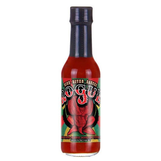 A bottle of High River Sauces Rogue Hot Sauce filled with a bright red-orange sauce. The bottle has a black cap and a vivid label featuring bold red lettering reading “Rogue,” set over an illustration of a fiery Trinidad Scorpion pepper with a blood-orange theme. The background includes green, yellow, and black accents. The bottom of the label reads “Blood Orange Scorpion Pepper Sauce” and shows the size as 5.4 fl. oz (163 mL).