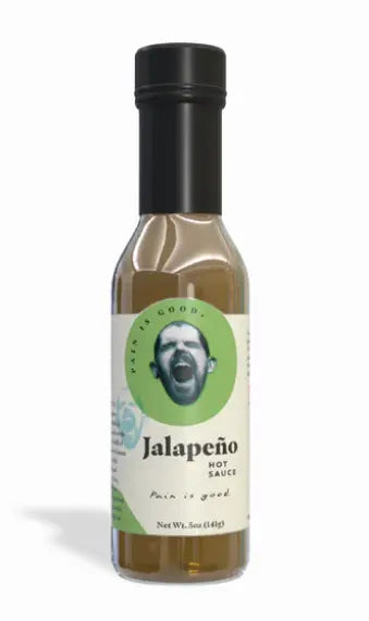 Glass bottle of Most Wanted Pain Is Good Jalapeño Hot Sauce with green label and black cap, net weight 7 oz (198 g), SKU 1469, UPC 032458960926