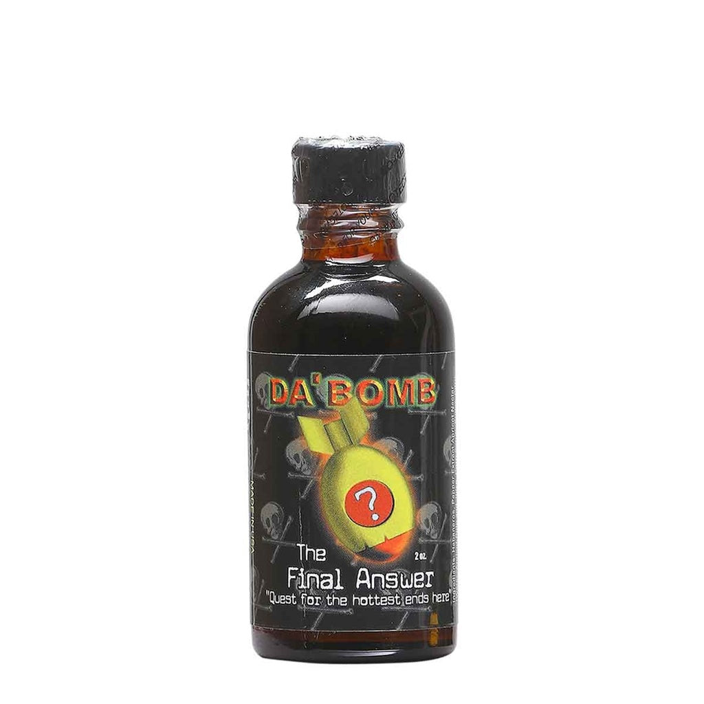 A small 2-ounce bottle of Da’ Bomb “The Final Answer” hot sauce. The bottle is dark with a black cap, and the label features a glowing green bomb graphic with a red question mark on it. The background shows a pattern of faint skulls, and the text reads “Da’ Bomb – The Final Answer – Quest for the hottest ends here.”
