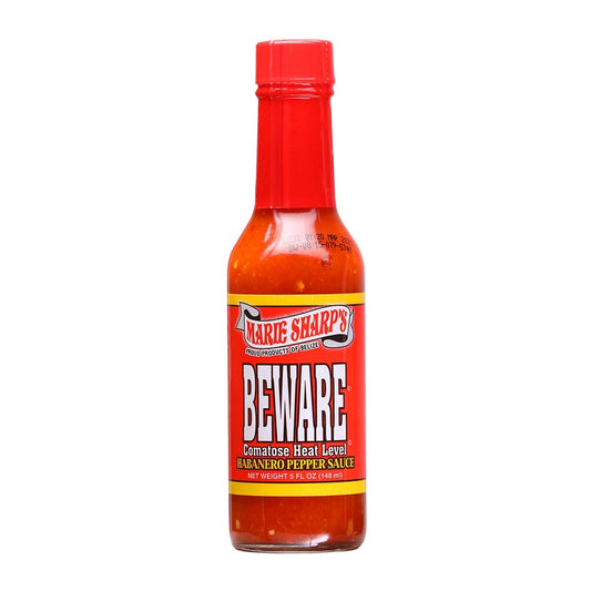Marie Sharp’s Beware Comatose Hot Sauce bottle with red label, ultra-hot habanero pepper sauce from Belize, 5 fl oz