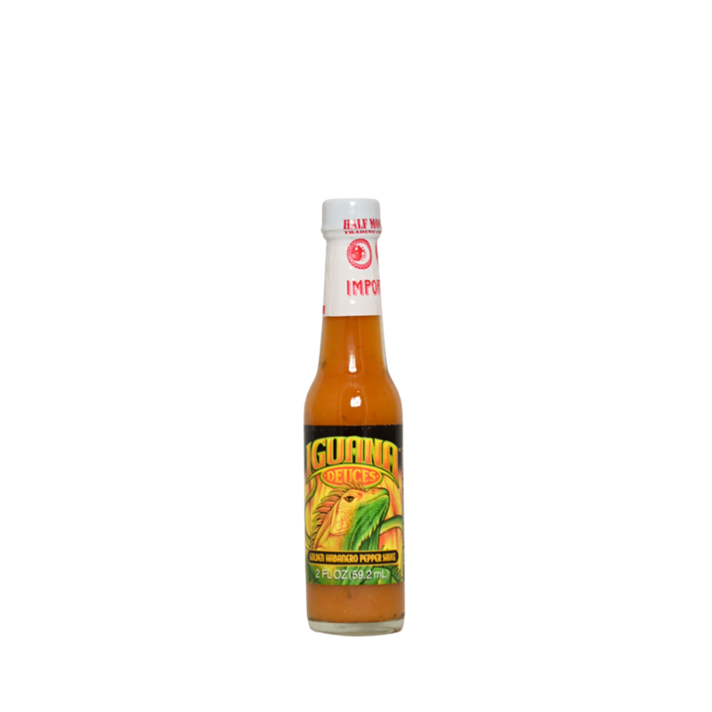 A small 2-oz glass bottle of Iguana Bold Gold Habanero Hot Sauce. The label features a colorful iguana illustration in green and yellow tones with the name “Iguana Deuces – Bold Gold Habanero Pepper Sauce.” The sauce inside is orange-gold, characteristic of Bajan-style mustard-habanero blends. UPC: 751059900291.