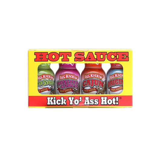 A yellow and red Ass Kickin’ Hot Sauce Mini 4-Pack gift box displaying four small bottles: Wasabi, Roasted Garlic, Cajun, and Original. The front reads “HOT SAUCE” at the top and “Kick Yo’ Ass Hot!” at the bottom.