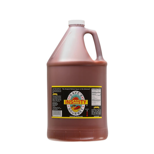 A large 1-gallon jug of Dave’s Gourmet Original Insanity Sauce filled with dark red hot sauce. The jug has a white cap and a built-in handle, with a black label reading “Insanity Sauce” over the Dave’s Gourmet sun logo. The label includes usage warnings and nutritional information. The jug displays “128 fl oz (3.776 L).” UPC: 753469410018