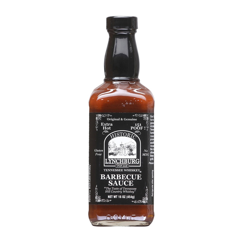 Glass bottle of Historic Lynchburg Tennessee Whiskey Fiery Hot Barbecue Sauce with black label and black cap, filled with deep reddish-brown barbecue sauce; labeled 16 oz and marked 151 Poof.