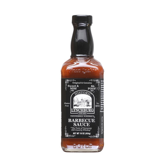 Glass bottle of Historic Lynchburg Tennessee Whiskey Sweet &amp; Mild Barbecue Sauce with black label and black cap, filled with dark reddish-brown barbecue sauce; labeled 16 oz.