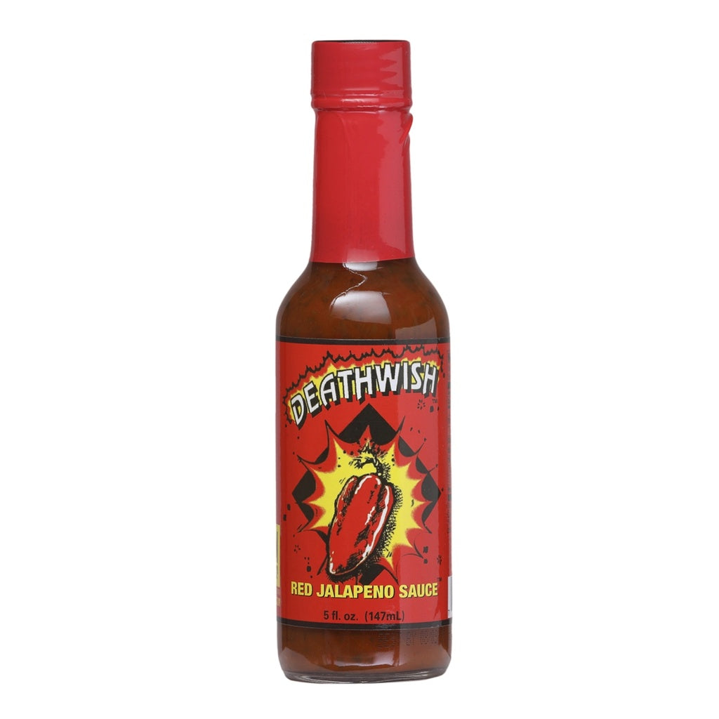 A bottle of Deathwish Red Jalapeño Hot Sauce filled with reddish-brown sauce. The bottle has a bright red cap and a bold red label featuring a bursting red jalapeño pepper in the center. The label reads “Deathwish” at the top and “Red Jalapeño Sauce” near the bottom, with the size listed as 5 fl. oz. (147 mL).