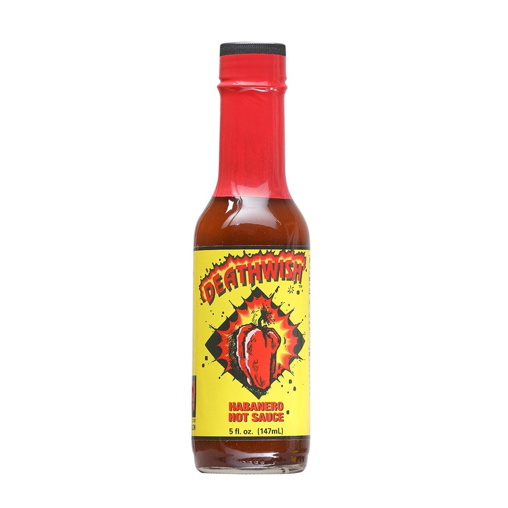 A bottle of Deathwish Habanero Hot Sauce filled with reddish-brown sauce. The bottle has a red cap and a bright yellow label featuring a cracking red habanero pepper bursting through the center. The label reads “Deathwish” at the top and “Habanero Hot Sauce,” with the size listed as 5 fl. oz. (147 mL).