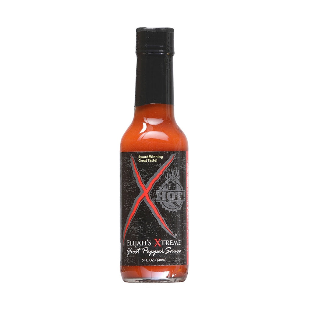 A 5-ounce bottle of Elijah’s Xtreme Ghost Pepper Sauce with a black label featuring a large red “X” and a flame graphic. The sauce inside is bright orange-red, and the bottle has a black cap.