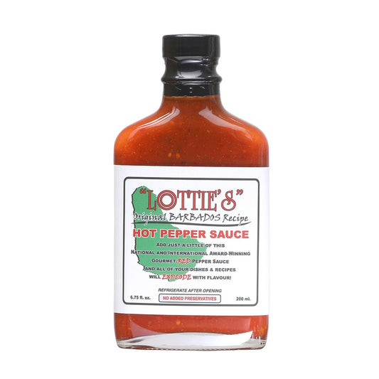 A square glass bottle of Lottie’s Original Barbados Red Hot Pepper Sauce filled with a bright red, pepper-speckled sauce. The bottle has a black cap and a white label with green and red text that reads “Lottie’s Original Barbados Recipe – Hot Pepper Sauce.” The label includes a small outline of Barbados and notes that it is a gourmet red pepper sauce with no added preservatives.