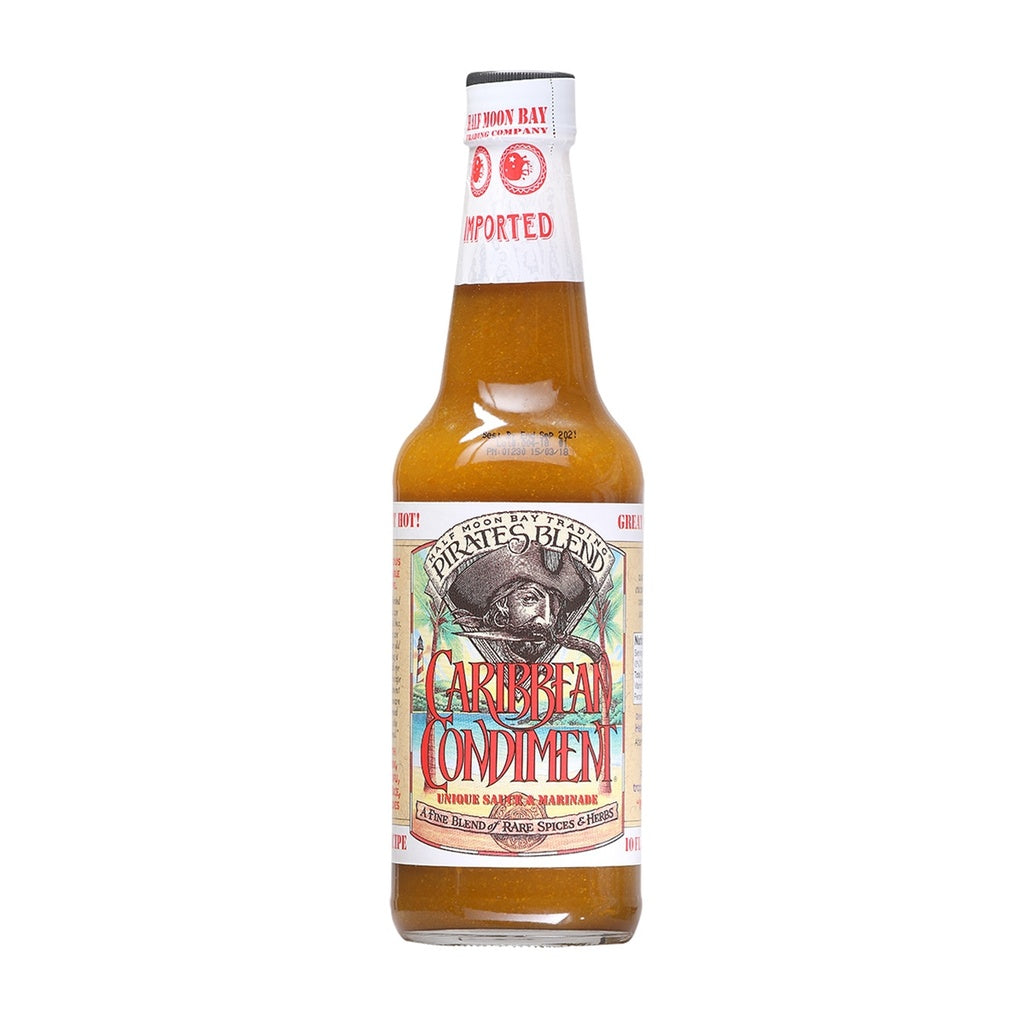 Glass bottle of Pirates Blend Caribbean Condiment Unique Sauce &amp; Marinade with tan and red label and golden sauce inside, 12 fl oz, UPC 751059900055
