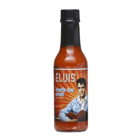 A 5-fl-oz bottle of Elvis Don’t Be Cruel Hot Sauce with a retro label featuring a photo of Elvis Presley in a blue jacket against a warm orange background. The bottle holds bright reddish hot sauce and reads “Elvis Don’t Be Cruel Hot Sauce.” UPC: 870128008857.