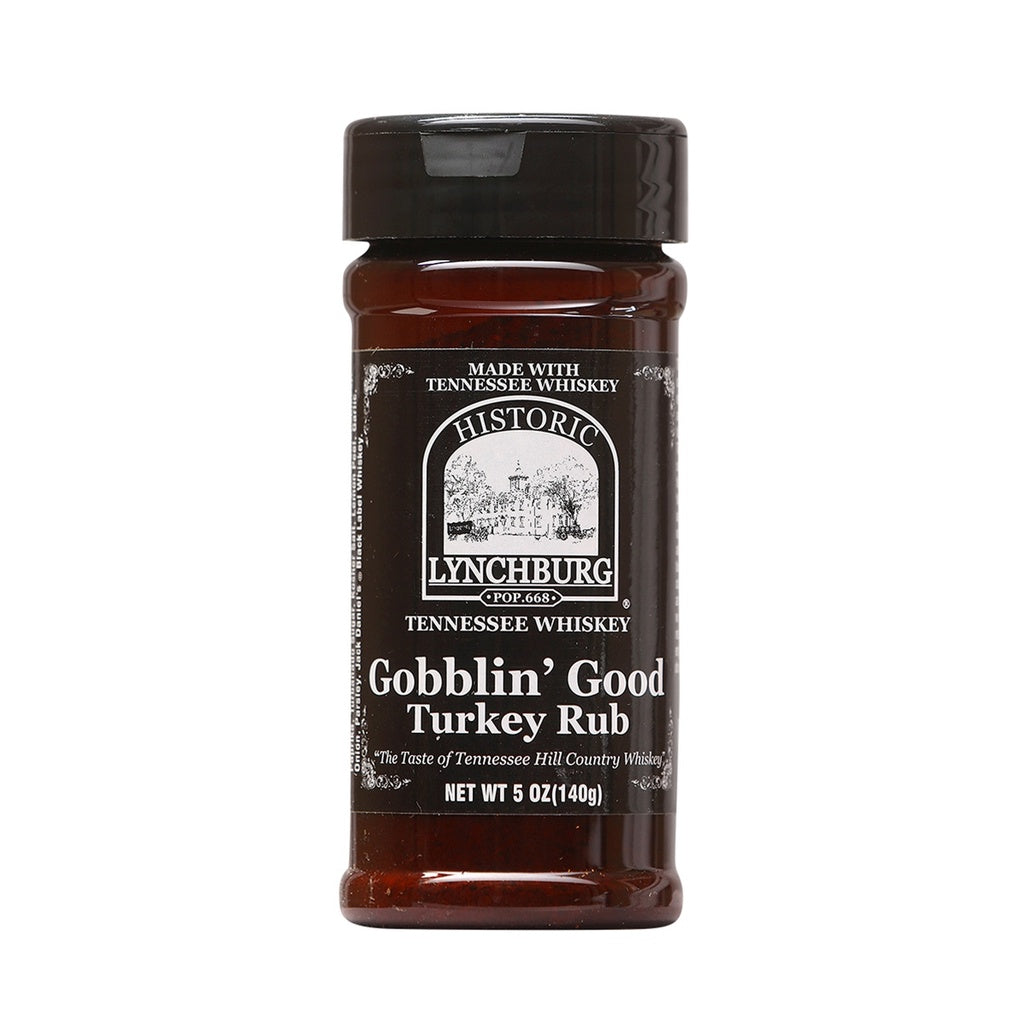 Plastic spice jar of Historic Lynchburg Tennessee Whiskey Gobblin’ Good Turkey Rub with brown label, black cap, and dry herb seasoning inside; labeled 5 oz.