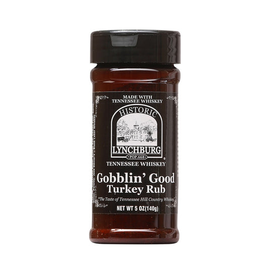 Plastic spice jar of Historic Lynchburg Tennessee Whiskey Gobblin’ Good Turkey Rub with brown label, black cap, and dry herb seasoning inside; labeled 5 oz.