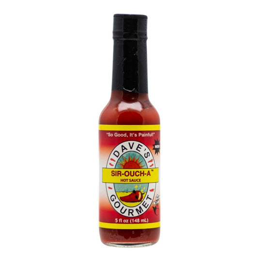 A 5-oz glass bottle of Dave’s Gourmet Sir-Ouch-A Hot Sauce with a black cap and deep red sauce inside. The label shows the Dave’s Gourmet sun logo and the name “Sir-Ouch-A Hot Sauce.” At the bottom, the label reads “5 fl oz (148 mL).” UPC: 753469000134