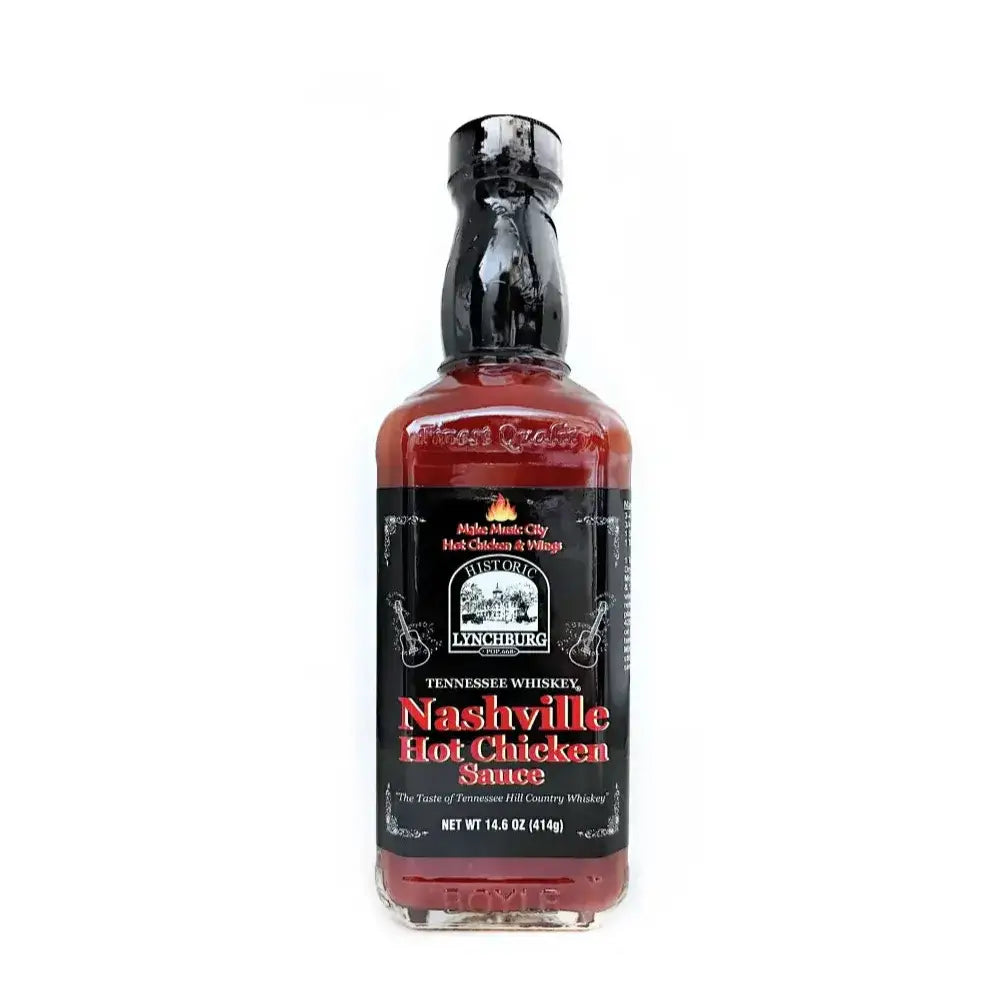 Glass bottle of Historic Lynchburg Tennessee Whiskey Nashville Hot Chicken Sauce with black label and black cap, filled with deep red hot sauce; labeled 14.6 oz.