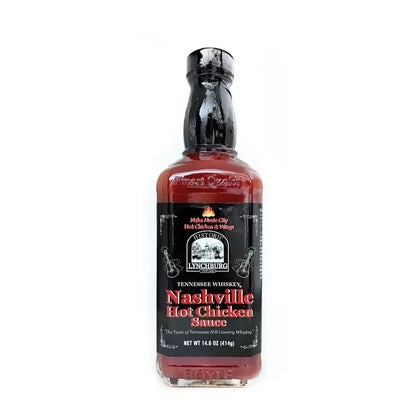 Glass bottle of Historic Lynchburg Tennessee Whiskey Nashville Hot Chicken Sauce with black label and black cap, filled with deep red hot sauce; labeled 14.6 oz.