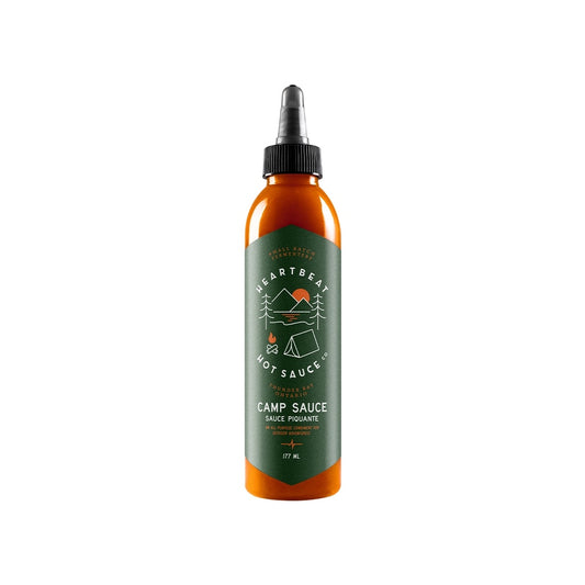 Tall squeeze bottle of Heartbeat Camp Sauce with green label featuring outdoor camping icons and orange-red sauce inside; labeled 177 mL / 6 fl oz.