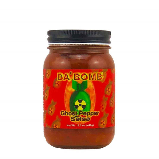 A jar of Da’ Bomb Ghost Pepper Salsa, 15.5 ounces. The jar has a black lid and a bright red label featuring multiple bomb icons and a large green bomb graphic with a radiation symbol. The salsa inside is a chunky red blend visible through the glass.