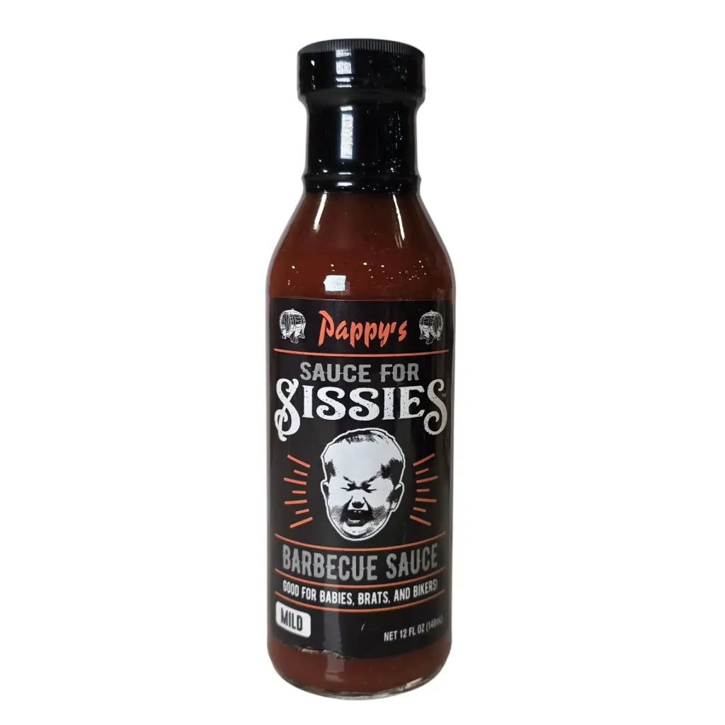 A 12 fl oz bottle of Pappy’s Sauce for Sissies Barbecue Sauce. The bottle has a black cap and a dark label with vintage-style lettering. The label features the brand name “Pappy’s” at the top, and below it the bold text “Sauce for Sissies.” A cartoon image of a crying baby is centered on the label. The bottom section reads “Barbecue Sauce” with the tagline “Good for babies, brats, and bikers!” A small box indicates the heat level as “Mild.”