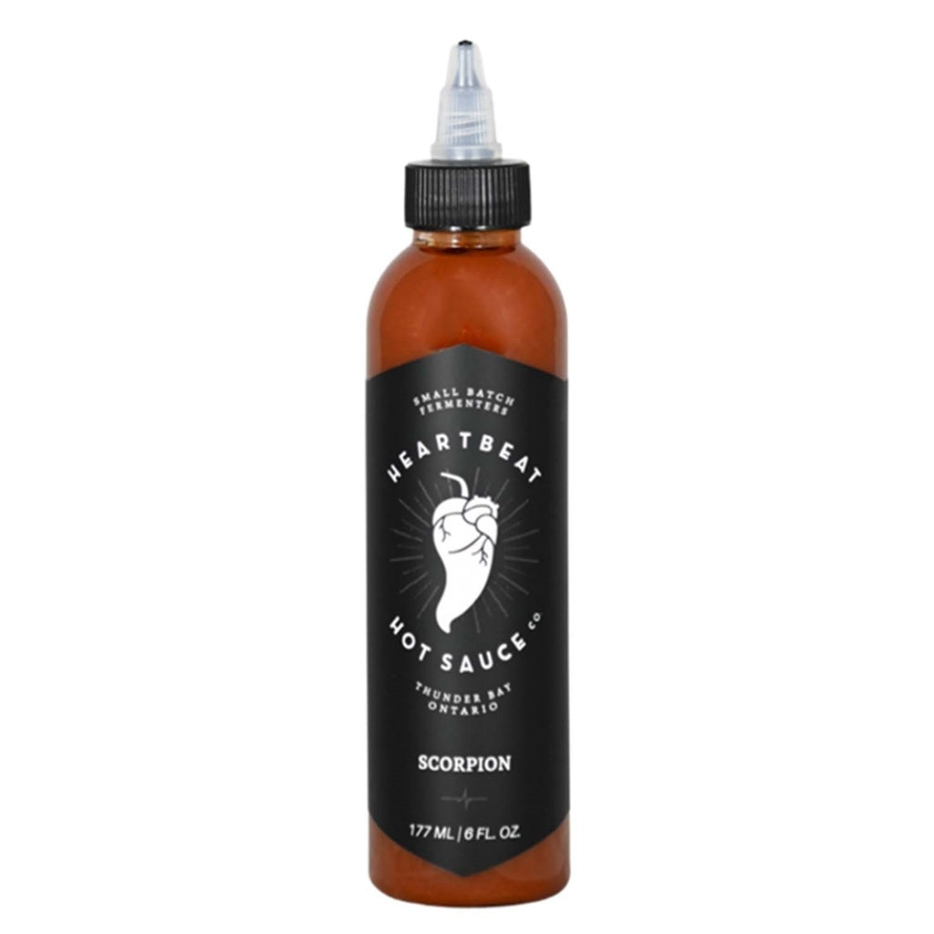 Tall squeeze bottle of Heartbeat Scorpion Hot Sauce with a black label featuring a white pepper heart logo; deep red-brown sauce visible; labeled “Scorpion” with 177 mL / 6 fl oz at the base.