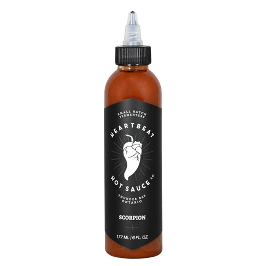 Tall squeeze bottle of Heartbeat Scorpion Hot Sauce with a black label featuring a white pepper heart logo; deep red-brown sauce visible; labeled “Scorpion” with 177 mL / 6 fl oz at the base.