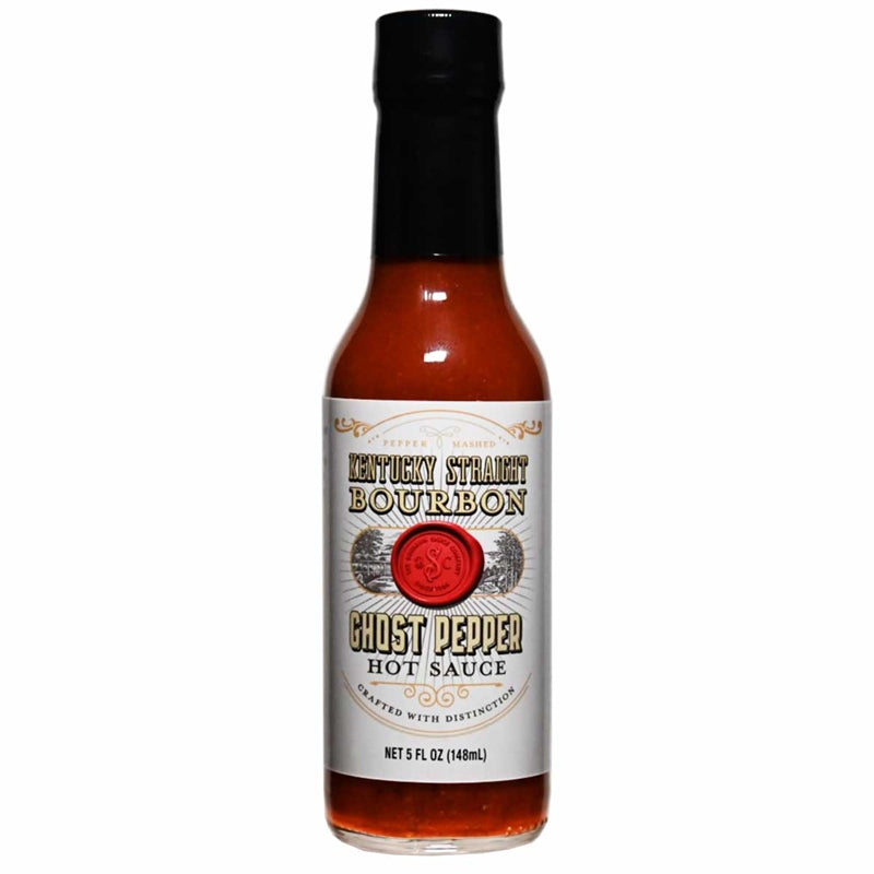A 5-ounce glass bottle of Kentucky Straight Bourbon Ghost Pepper Hot Sauce with a white label and black cap. The label features gold and black lettering, a red wax-seal style emblem, and the words “Ghost Pepper Hot Sauce” displayed prominently.