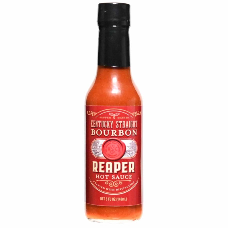 A 5-ounce glass bottle of Kentucky Straight Bourbon Reaper Hot Sauce with a red label, black cap, and bold lettering. The label features decorative accents, a wax-seal style emblem, and the words “Reaper Hot Sauce” prominently displayed.