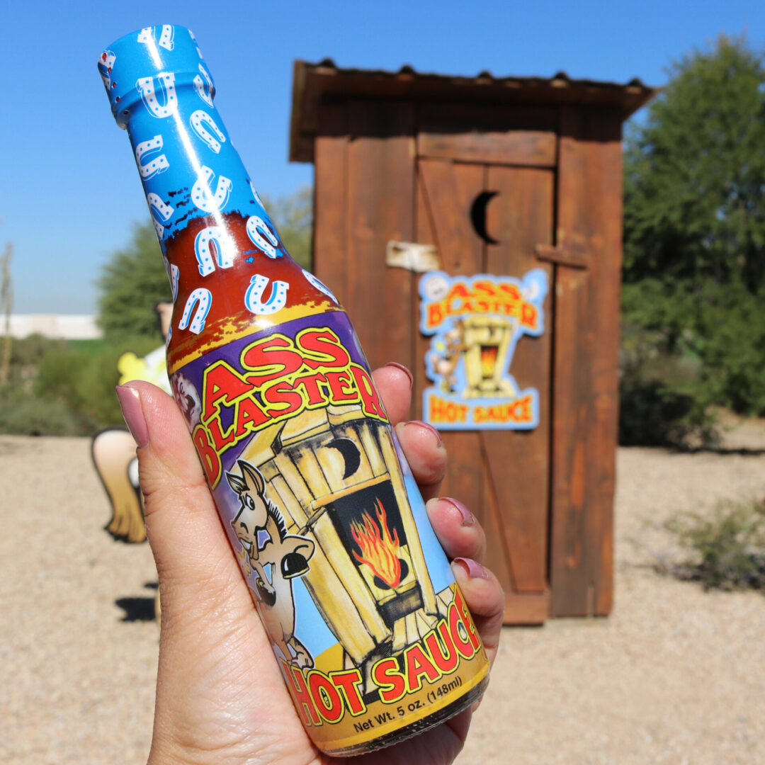 Ass Kickin' Ass Blaster Hot Sauce – 0.75 oz, featuring Habanero, shown in a manufacturer lifestyle setting