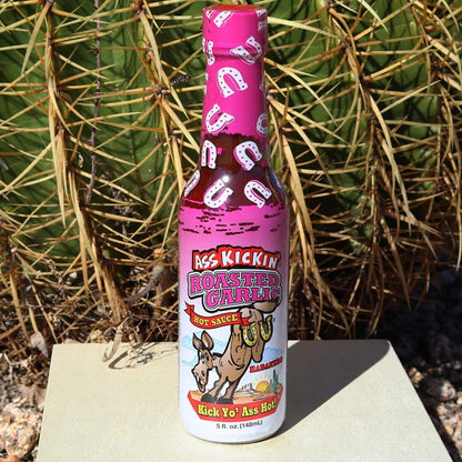 Ass Kickin' Roasted Garlic Hot Sauce - 0.75 fl oz, featuring Habanero, shown in a manufacturer lifestyle setting
