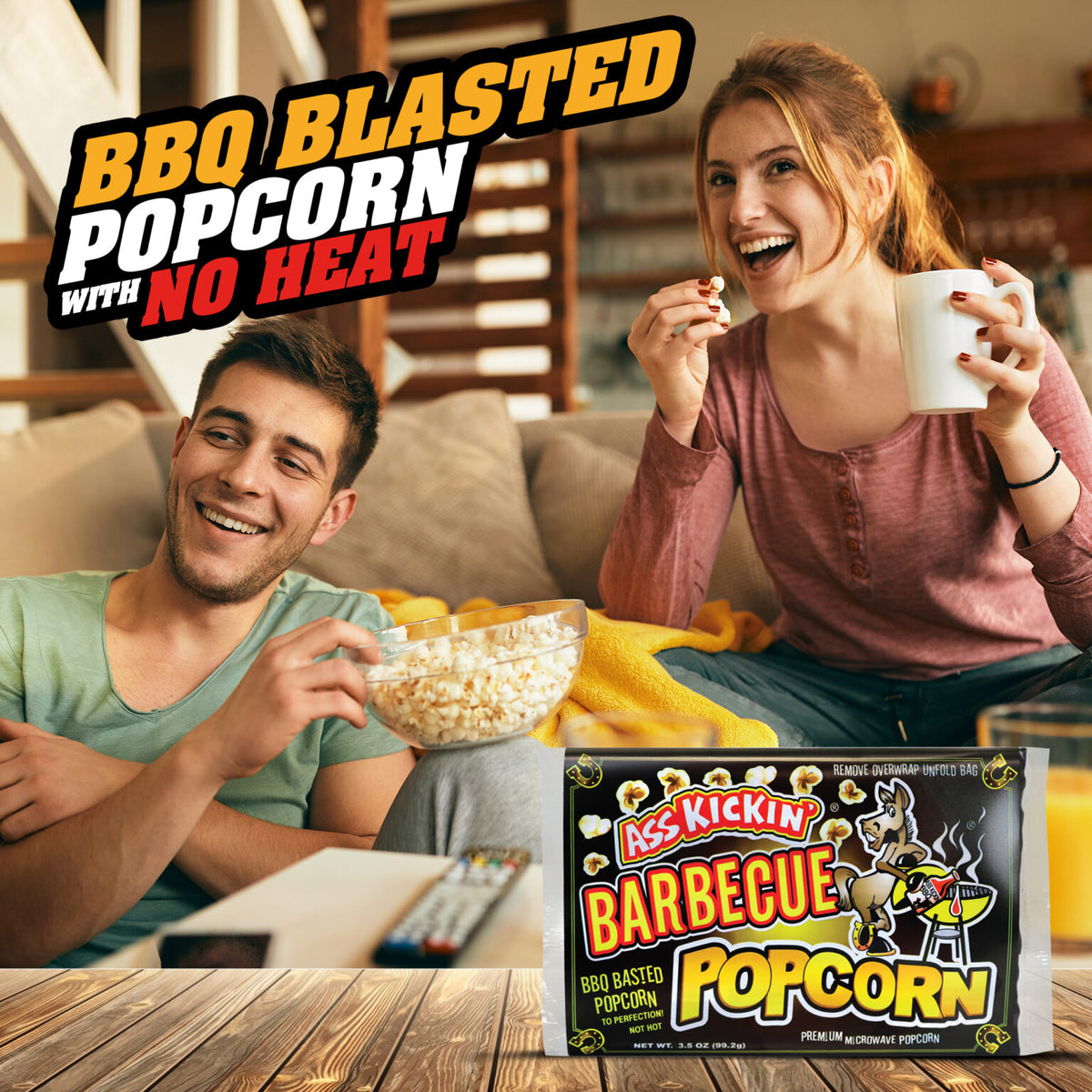 Two people enjoying BBQ Blasted Popcorn with a package of the product in the foreground.
