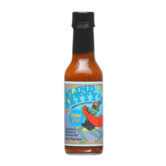 A bottle of Blind Betty's Original Hot Sauce, featuring a vibrant label with chili pepper imagery and the text 'Blind Betty's Original Hot Sauce - The Sauce That Wins Awards and Hearts!' The background evokes a Caribbean theme, suggesting a tropical vacation for the taste buds. UPC: 830139000011