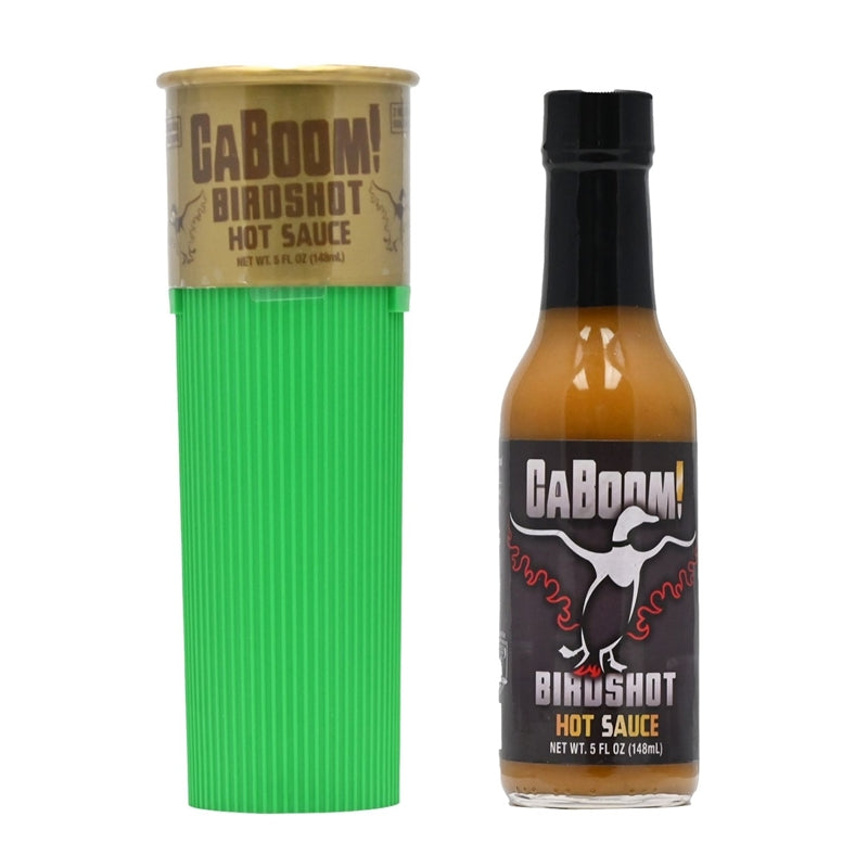 A bottle of CaBoom! Bird Shot Hot Sauce designed with a shotgun shell-themed label featuring an illustration of a shotgun shell and the text "CaBoom! Bird Shot Hot Sauce: The Perfect Ammo for Your Tastebuds! UPC: 647293010240