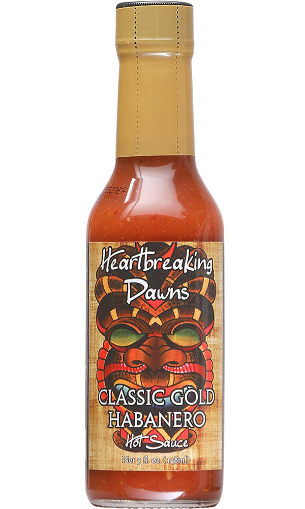 A bottle of Heartbreaking Dawn's Classic Gold Hot Sauce featuring a vibrant label with a golden and fiery theme, emphasizing the text 'Ignite Your Taste Buds with Heartbreaking Dawn's Classic Gold Hot Sauce!' The design exudes a sense of flavor excitement and heat. UPC: 094922413550.