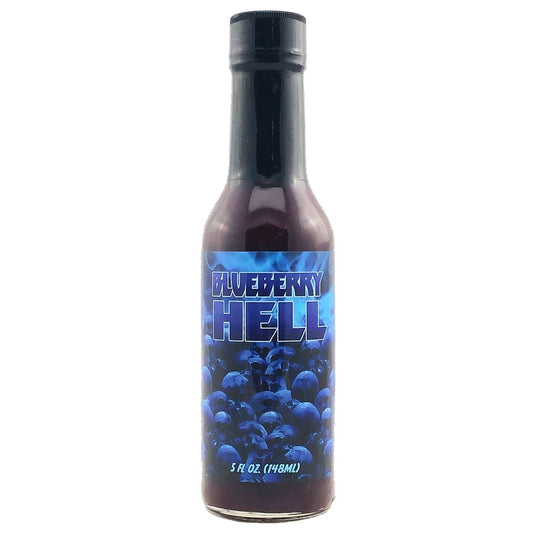 A bottle of Hellfire Blueberry Hell Hot Sauce. The label features flames, blueberries, and the text "Hellfire Blueberry Hell Hot Sauce: The Sweet and Spicy Dance of Flavors!" UPC: 855713005046.