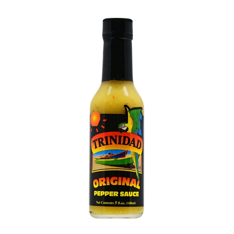 A bottle of Trinidad Original Pepper Sauce, featuring a vibrant label with tropical colors, palm trees, and the Trinidad and Tobago flag. The 5 oz. bottle contains a blend of onions, habanero peppers, vinegar, green peppers, celery, mustard, ginger, garlic, salt, thyme, basil, and other fine herbs. UPC: 095488100014.