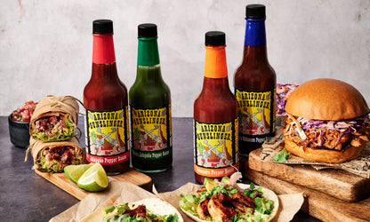 Arizona Gunslinger Smokin' Hot Red Jalapeño Pepper Sauce 5 fl oz, featuring Jalapeño, shown in a manufacturer lifestyle setting